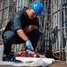 Sailor paints in the flight deck of USS Carl Vinson