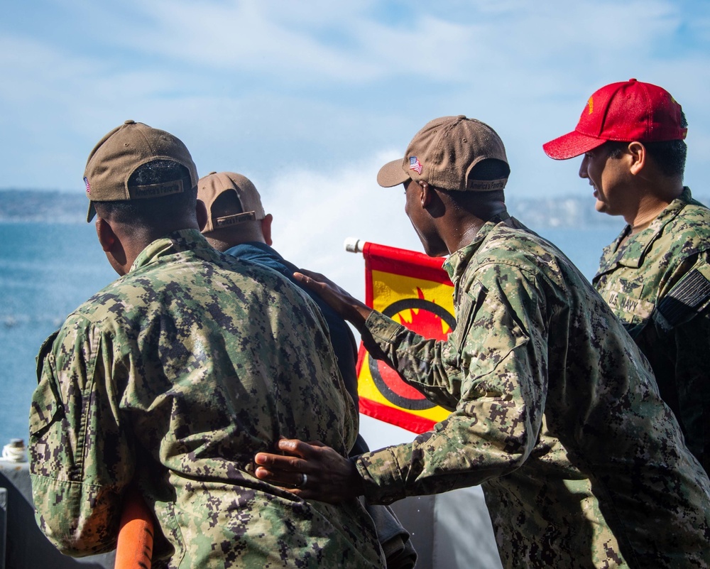 Sailors run damage control drills on the fantail of USS Carl Vinson