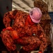 Sailor performs maintenance in the hangar bay of USS Carl Vinson