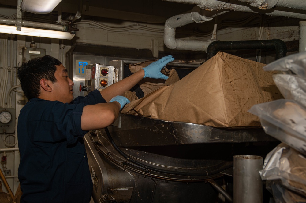 USS Ronald Reagan (CVN 76) Sailors perform waste management duties