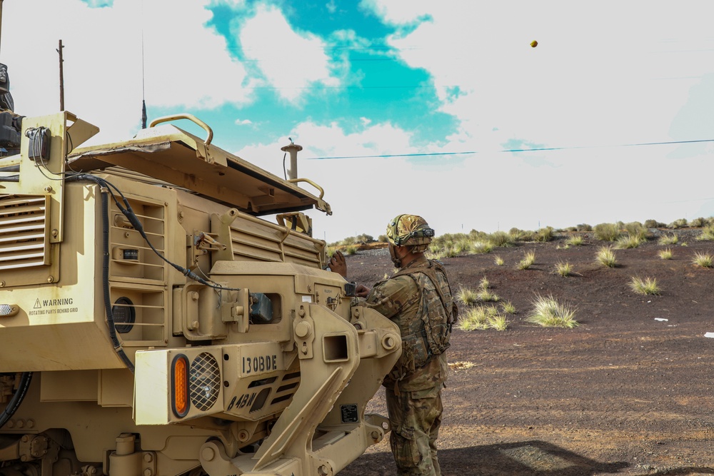 Engineer Soldiers form the 130th Engineer Brigade conduct preventive maintenance on their vehicles and weapon systems