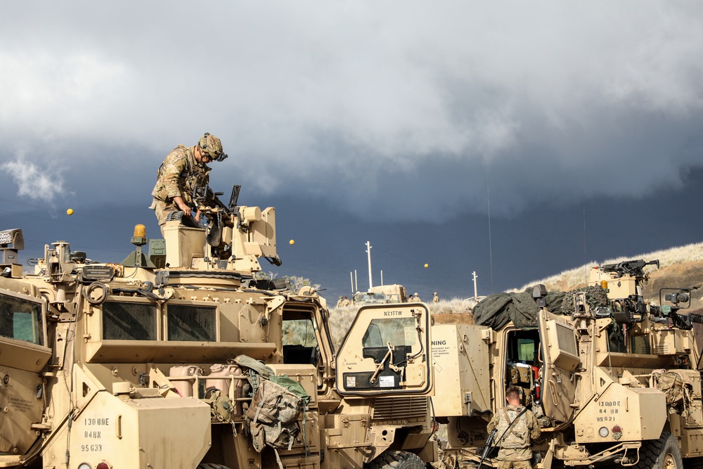 Engineer Soldiers form the 130th Engineer Brigade conduct preventive maintenance on their vehicles and weapon systems