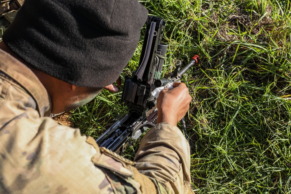 Engineer Soldiers form the 130th Engineer Brigade conduct preventive maintenance on their vehicles and weapon systems