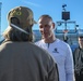 Michigan State University basketball players tour USS Abraham Lincoln