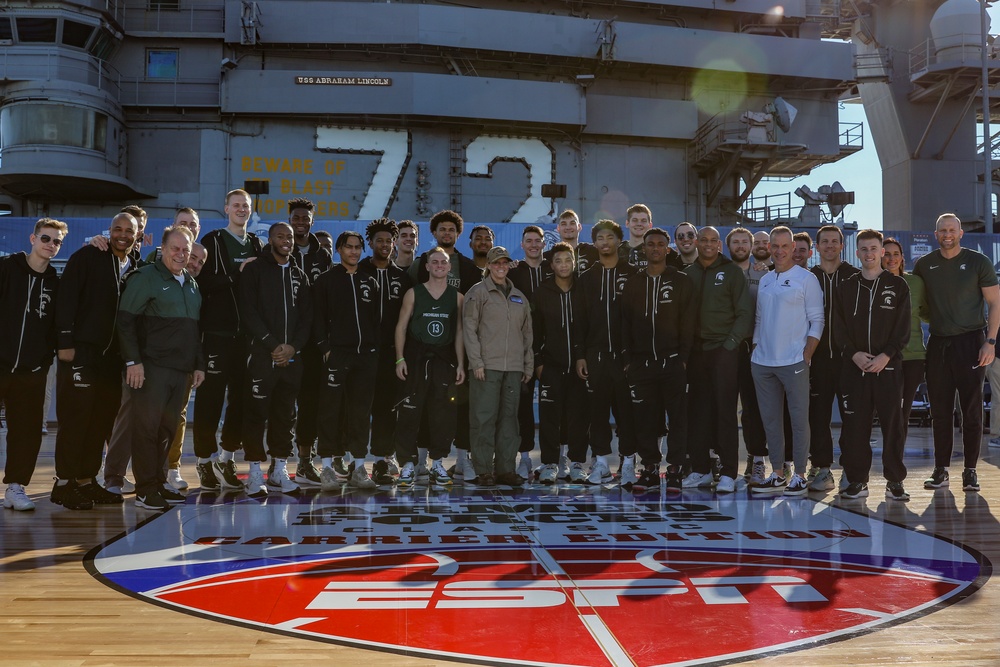 Michigan State University basketball players tour USS Abraham Lincoln