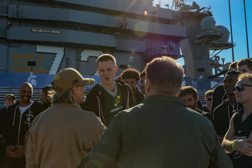 Michigan State University basketball players tour USS Abraham Lincoln