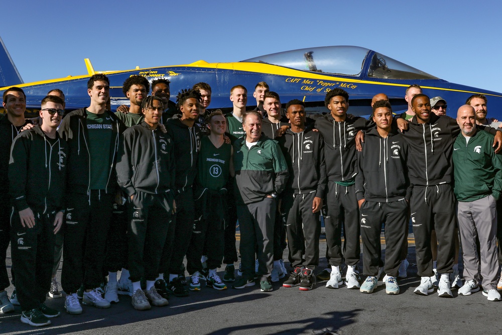 Michigan State University basketball players tour USS Abraham Lincoln