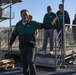 Michigan State University basketball players tour USS Abraham Lincoln