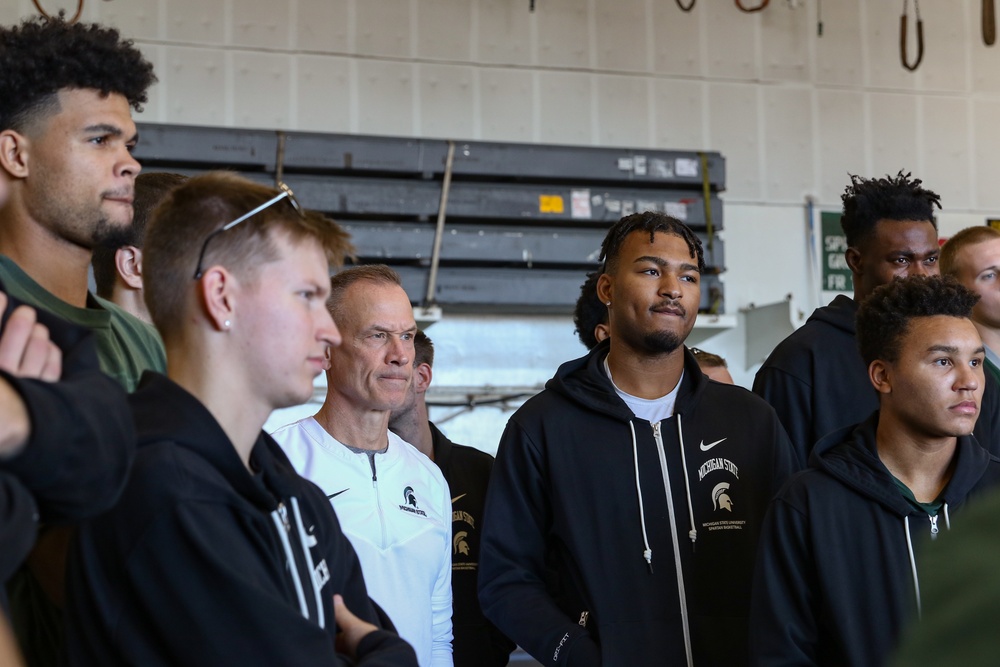 Michigan State University basketball players tour USS Abraham Lincoln