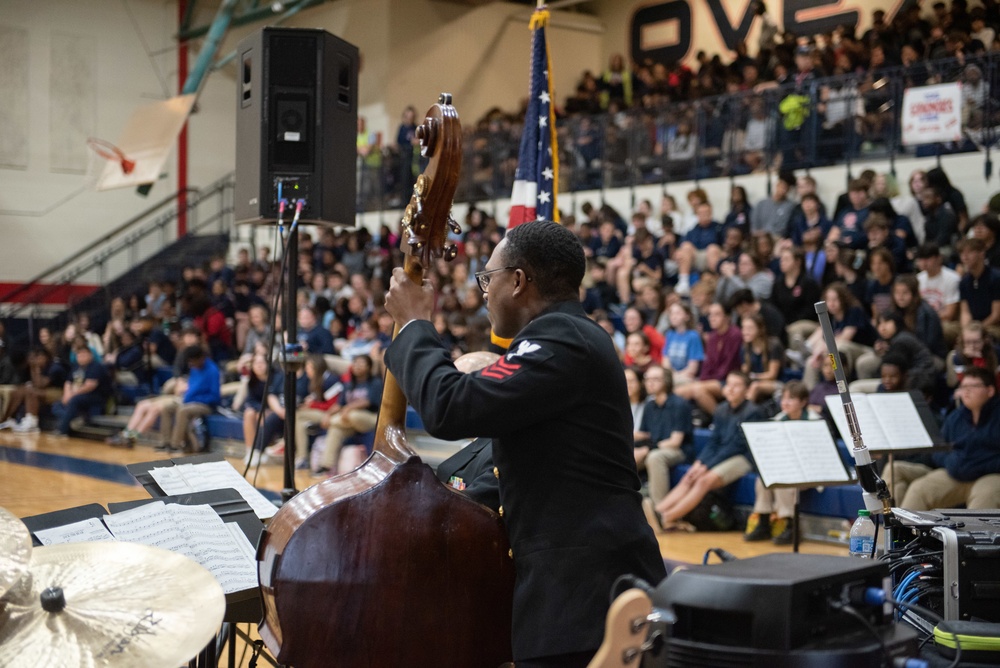 The U.S. Navy Band Commodores perform at Ovey Comeaux High School in Lafayette, Louisiana.