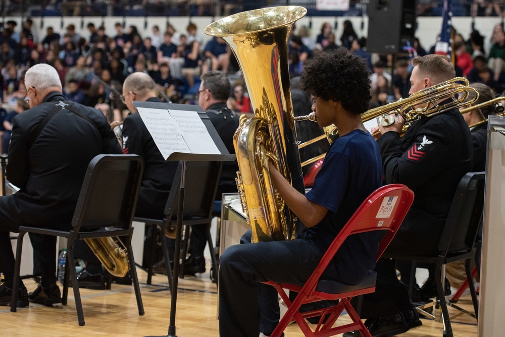 The U.S. Navy Band Commodores perform at Ovey Comeaux High School in Lafayette, Louisiana.