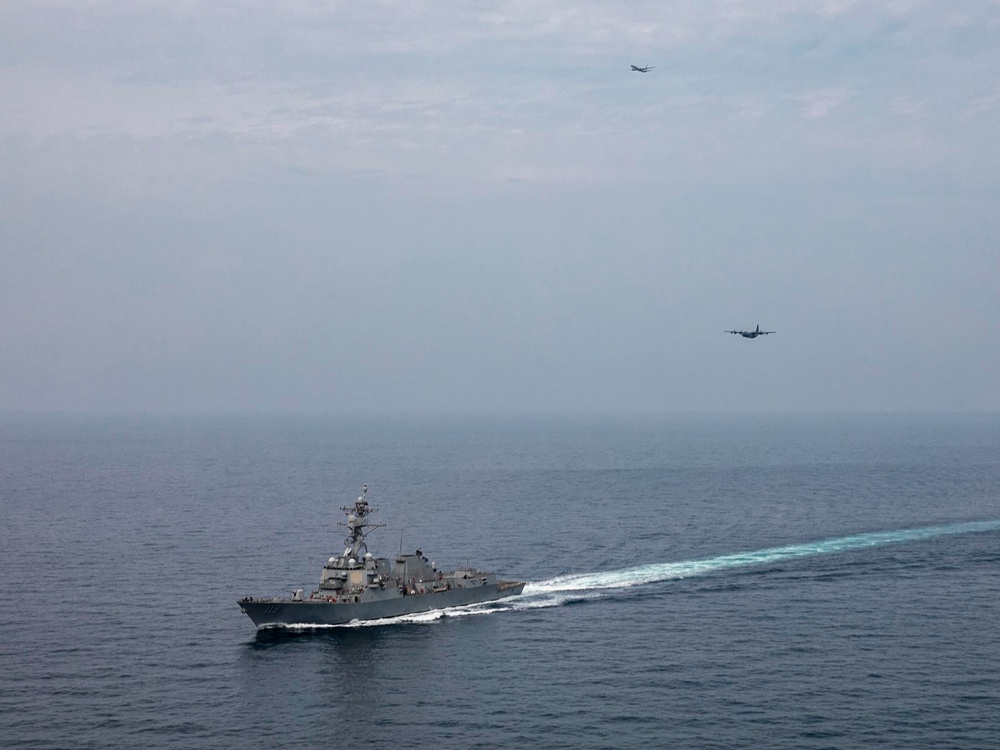 USS Delbert D. Black Operates with AC-130J and P-8A