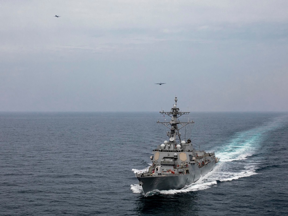 USS Delbert D. Black Operates with AC-130J and P-8A