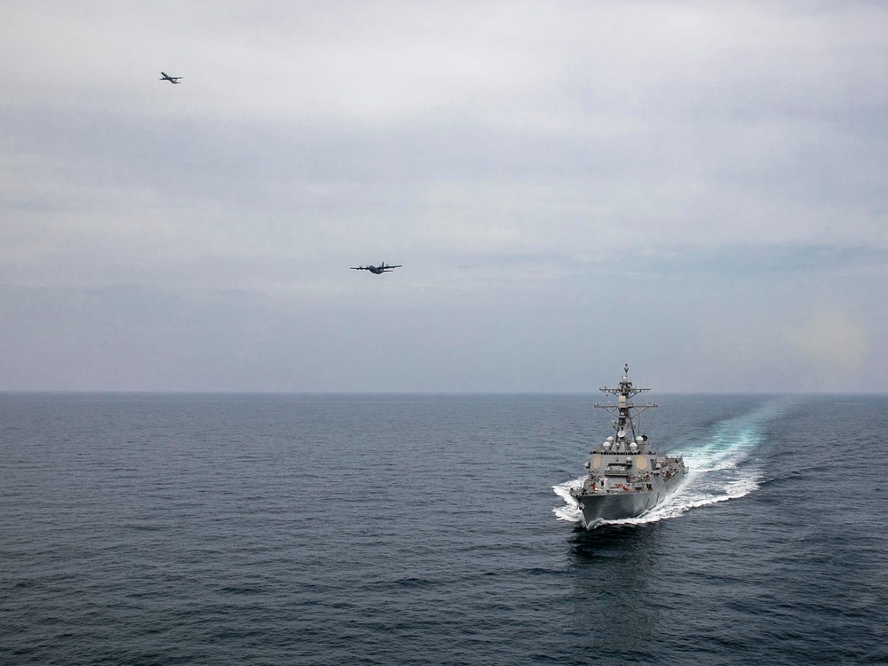 USS Delbert D. Black Operates with AC-130J and P-8A