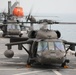 Task Force Mustang UH-60 Blackhawk and AH-64 Apache Flight Crews, land on the USS Lewis B. Puller