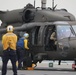 Task Force Mustang UH-60 Black Hawk and AH-64 Apache Flight Crews, land on the USS Lewis B. Puller