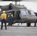 Task Force Mustang UH-60 Black Hawk and AH-64 Apache Flight Crews, land on the USS Lewis B. Puller