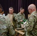 Soldiers, veterans, and volunteers distribute Thanksgiving care packages to families in need