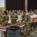 Soldiers, veterans, and volunteers distribute Thanksgiving care packages to families in need