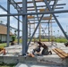 Seabees with Naval Mobile Construction Battalion 4, prefabricates walls for an outdoor multipurpose facility onboard U.S. Army Garrison - Kwajalein Atoll.