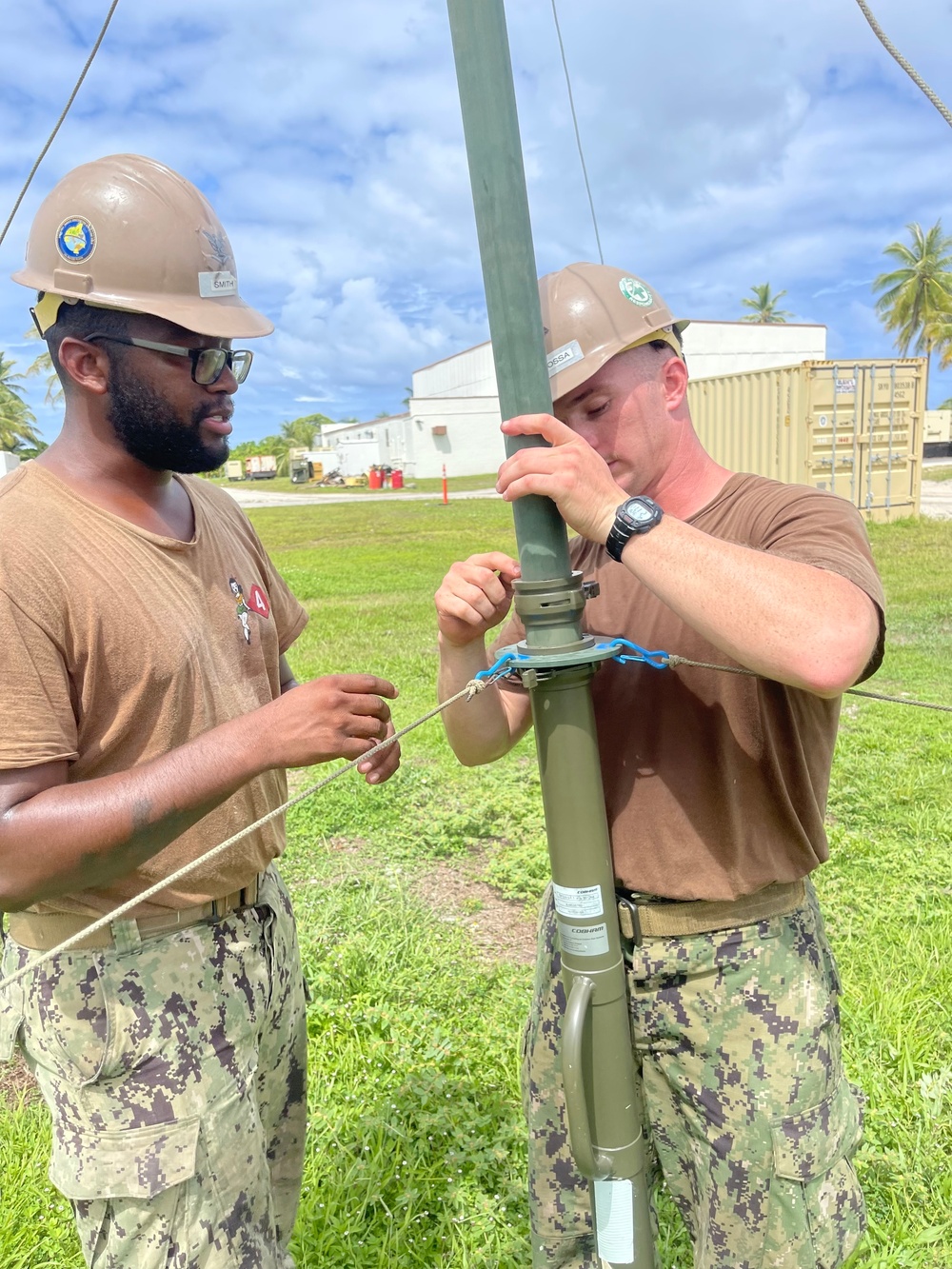 Seabees erect a High Frequency Communications (HFC) antenna for routine communications checks