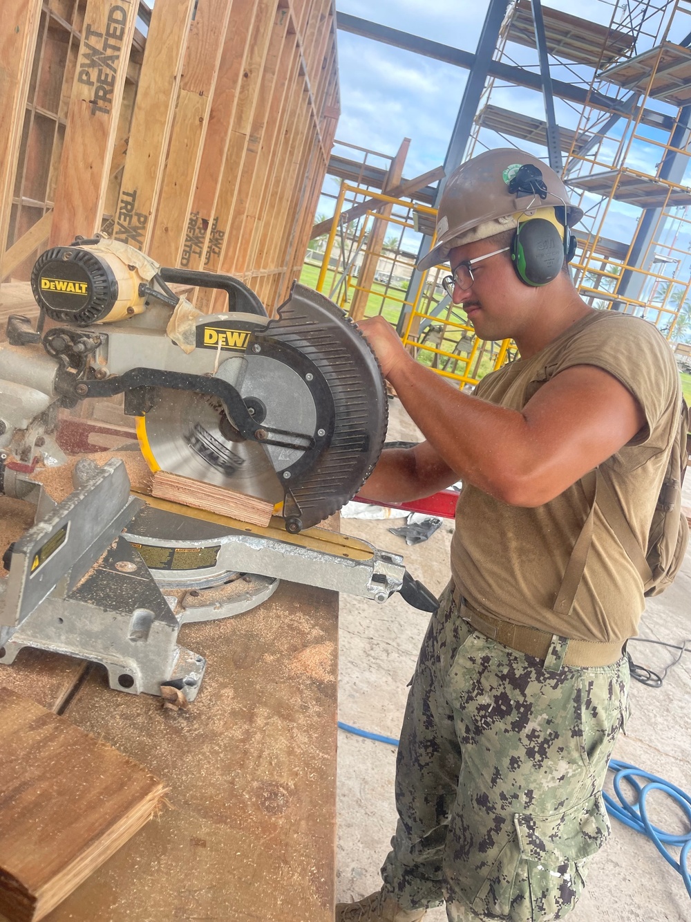 Steelworker 3rd Class Daniel Ceren, cuts support beams needed for the Richardson Multipurpose Facility.