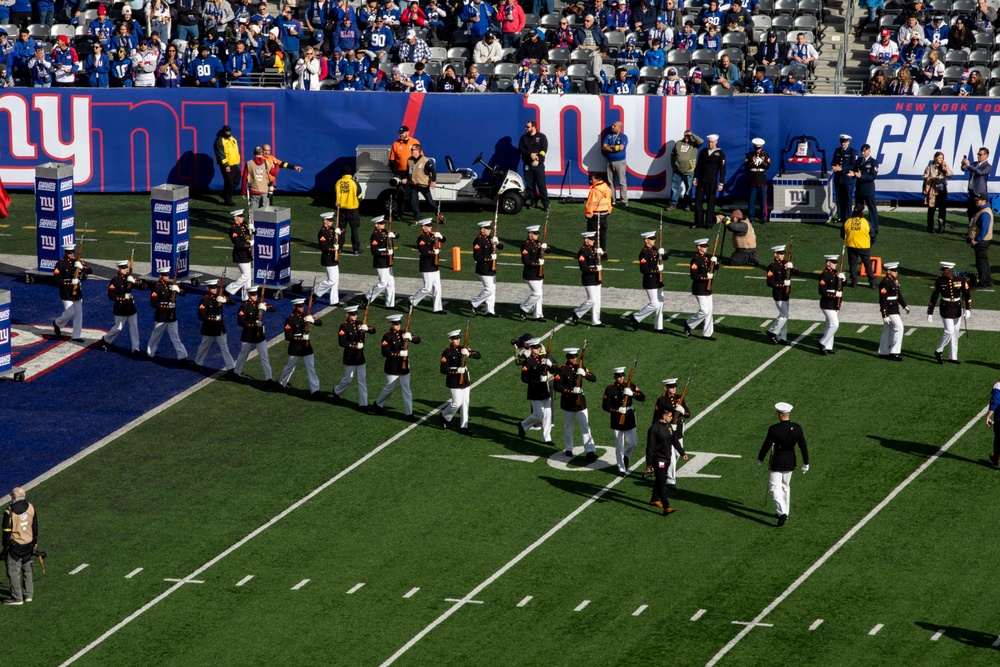 USS Arlington Sailors and Marines participate in pregame ceremonies