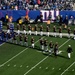 USS Arlington Sailors and Marines participate in pregame ceremonies