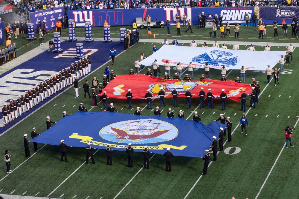 USS Arlington Sailors and Marines participate in pregame ceremonies