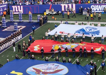 USS Arlington Sailors and Marines participate in pregame ceremonies
