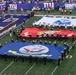 USS Arlington Sailors and Marines participate in pregame ceremonies