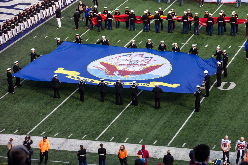 USS Arlington Sailors and Marines participate in pregame ceremonies