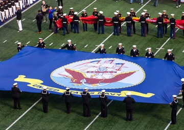 USS Arlington Sailors and Marines participate in pregame ceremonies