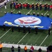 USS Arlington Sailors and Marines participate in pregame ceremonies