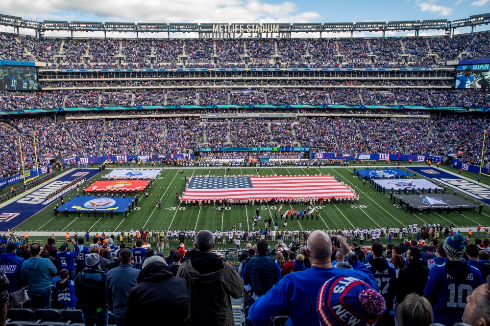 USS Arlington Sailors and Marines participate in pregame ceremonies