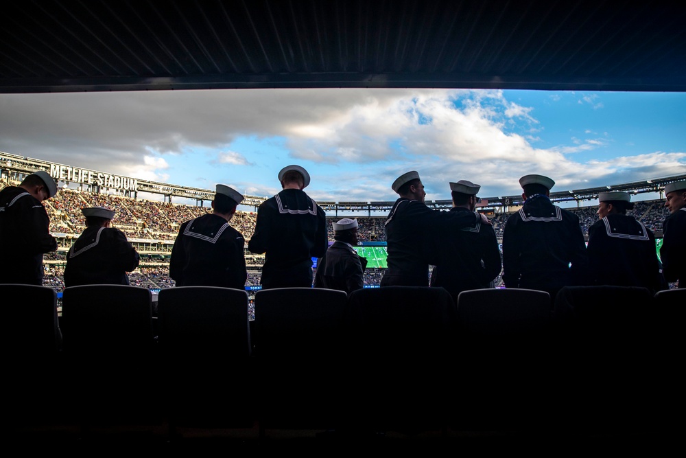 USS Arlington Sailors and Marines participate in pregame ceremonies