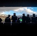 USS Arlington Sailors and Marines participate in pregame ceremonies