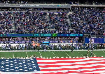 USS Arlington Sailors and Marines participate in pregame ceremonies