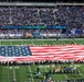 USS Arlington Sailors and Marines participate in pregame ceremonies