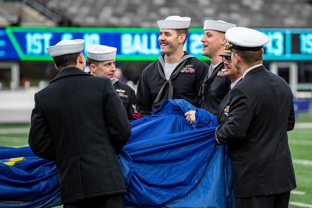 USS Arlington Sailors and Marines participate in pregame ceremonies