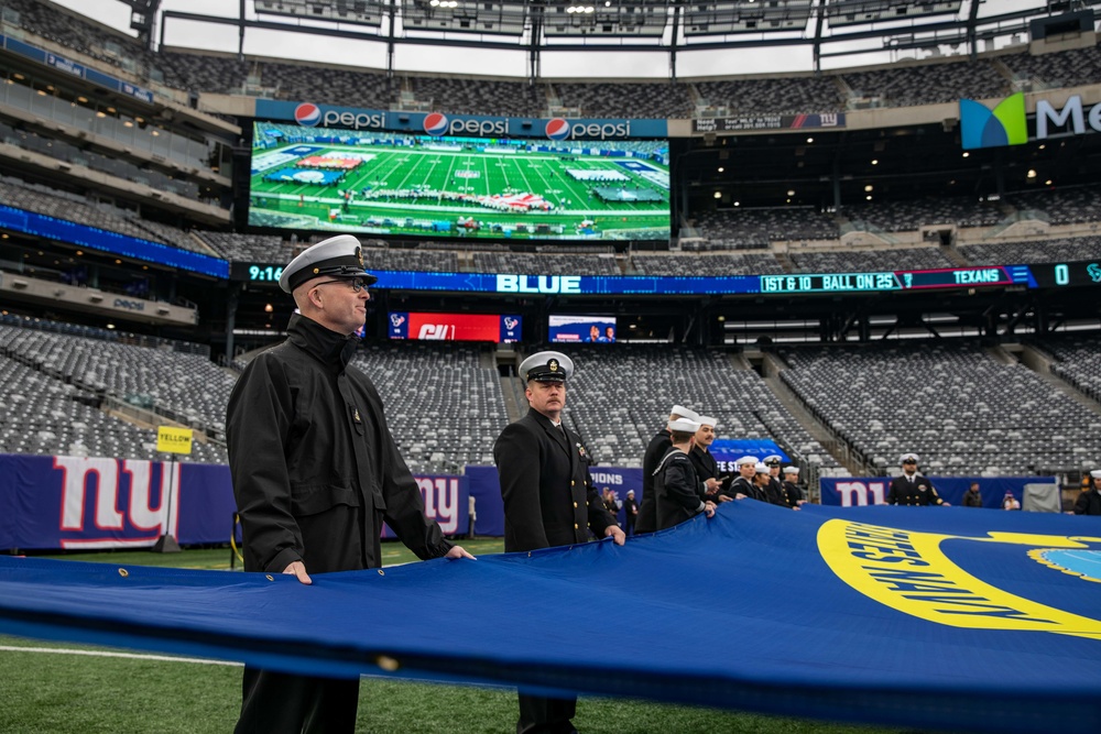 USS Arlington Sailors and Marines participate in pregame ceremonies