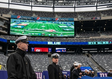 USS Arlington Sailors and Marines participate in pregame ceremonies