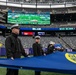 USS Arlington Sailors and Marines participate in pregame ceremonies