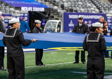 USS Arlington Sailors and Marines participate in pregame ceremonies