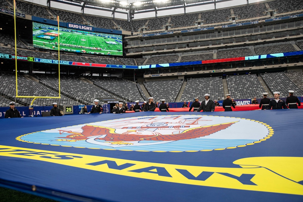 USS Arlington Sailors and Marines participate in pregame ceremonies