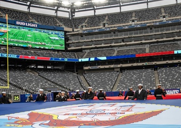 USS Arlington Sailors and Marines participate in pregame ceremonies