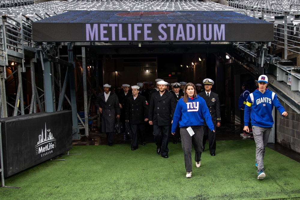 USS Arlington Sailors and Marines participate in pregame ceremonies