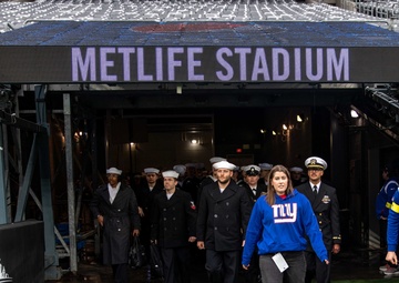 USS Arlington Sailors and Marines participate in pregame ceremonies