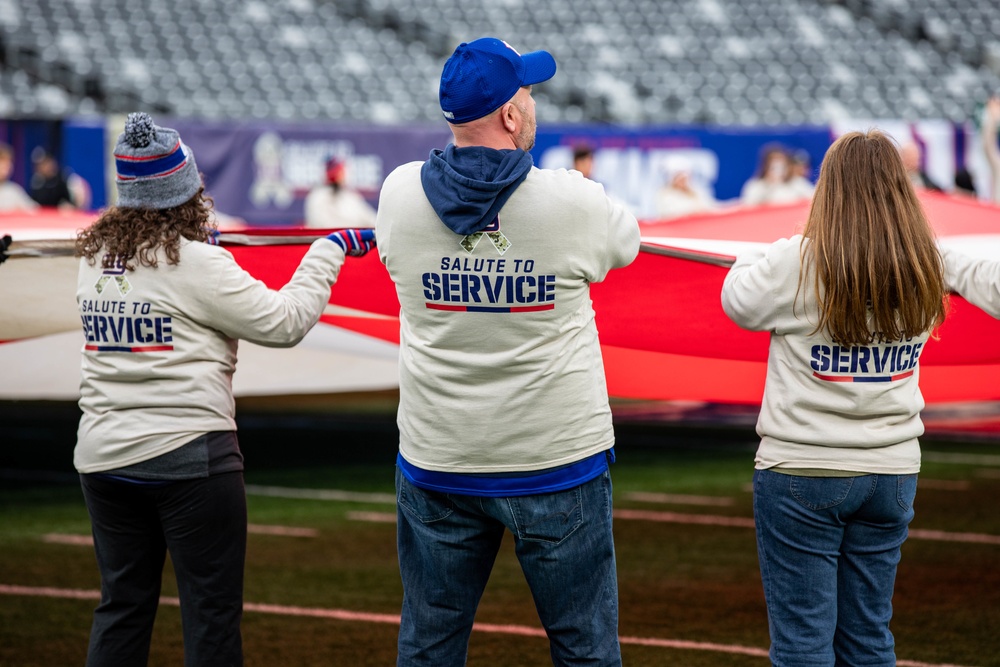 USS Arlington Sailors and Marines participate in pregame ceremonies