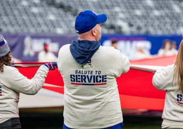 USS Arlington Sailors and Marines participate in pregame ceremonies